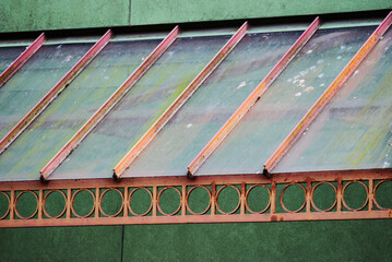 worn metal and glass awning