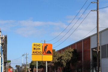 road work ahead sign in urban landscape