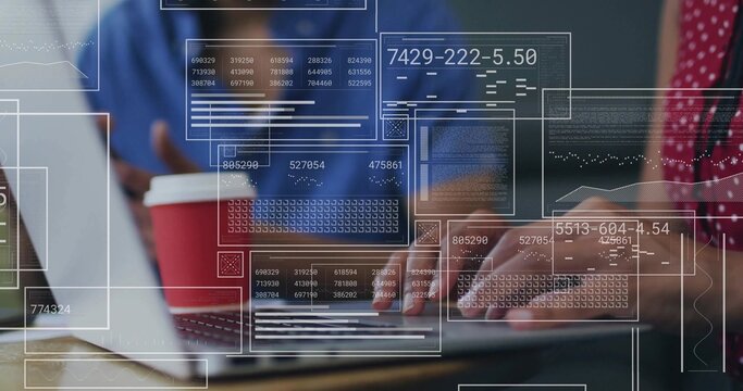 Typing software developers collaborating at modern office on wooden desk with laptop and coffee cup - Powered by Adobe