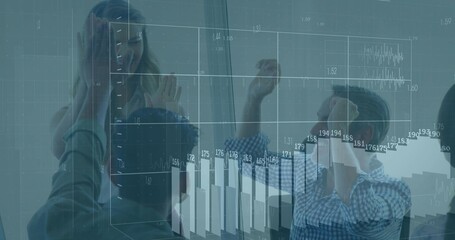 High-fiving office team celebrating milestone in meeting room, with holographic projections