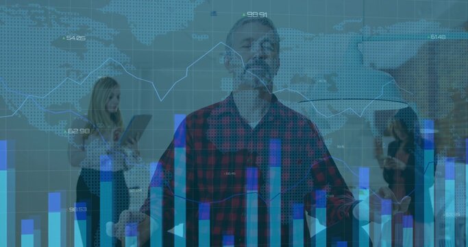 Standing mature man closing eyes lifting arms in office, with tablet and smartphone, data overlays