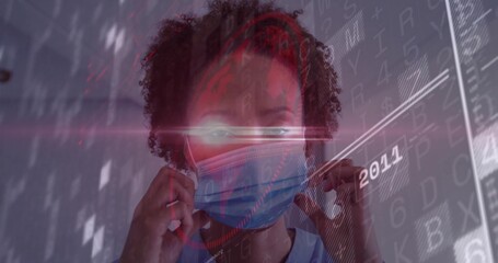 Adjusting African American woman in scrubs fitting surgical mask in clinic hallway, digital overlay