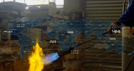 Heating gloved welder welding metal in workshop with blowtorch flame and digital map, copy space