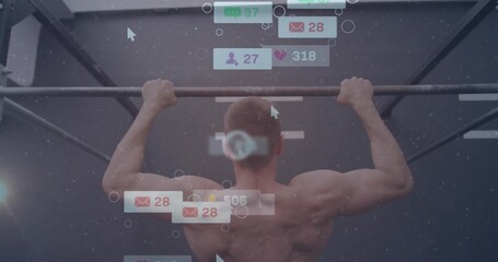 Performing shirtless athlete pulling up on rig bar in gym, with floating digital icons