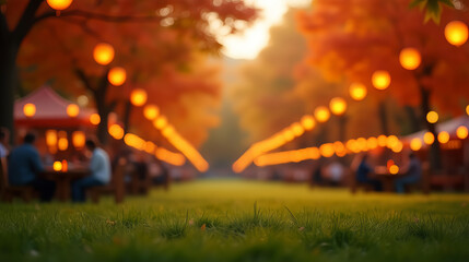 Naklejka premium Autumn outdoor dining scene with glowing lanterns and blurred festive atmosphere, green grass foreground and colorful fall foliage background for seasonal lifestyle or holiday celebration ads