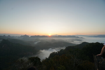 Sunrise over Mountain range with morning fog landscape view. Amazing nature scenery.  Tourism and travel viewpoint.