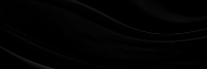 Black gray satin dark fabric texture luxurious shiny that is abstract silk cloth panorama background with patterns soft waves blur beautiful.