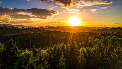 Scenic sunset over a forested mountain range