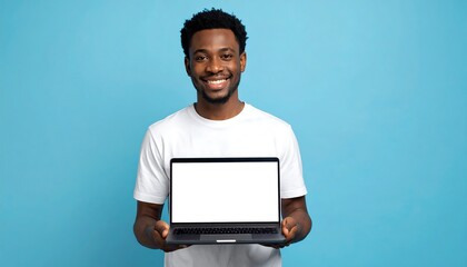 Man holding laptop, smiling