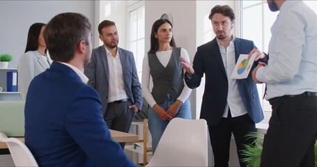 Sales presentation, diverse office employees and leader showing pie chart result gathered brainstorming together in co working office, staff listening to team leader, share ideas, offer solutions - Powered by Adobe