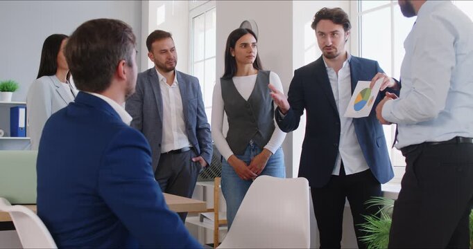 Sales presentation, diverse office employees and leader showing pie chart result gathered brainstorming together in co working office, staff listening to team leader, share ideas, offer solutions - Powered by Adobe