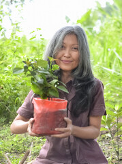 young woman planting flowers