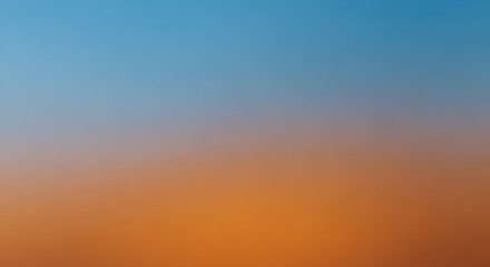 Obraz premium Vibrant Gradient of Blue and Orange Colors at Dusk with Soft Focus Background