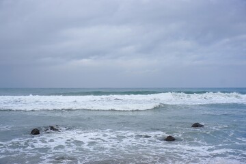 Obraz premium Waves crashing at Menganti beach Central Java Indonesia for coastal travel photography 