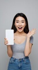 Excited Young Woman Holding Blank White Tablet, Showing Surprise and Joy