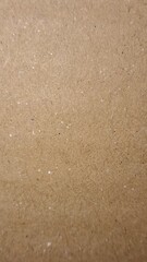 Fibrous Cardboard or Packing Paper. Earthy Tones and Uneven Grain for an Authentic Vintage or Sustainable Backdrop.