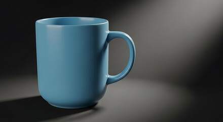 Obraz premium Blue ceramic mug on dark background with soft lighting