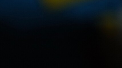 Dark gradient with subtle blue, yellow, and green glow and soft ambient fade wallpaper