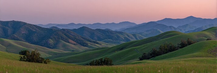 Rolling hills bathed in twilight hues, grassy foreground, distant mountains in soft focus, serene panoramic landscape