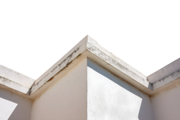 A crisp, angled view of a weathered white building corner with a detailed architectural trim.