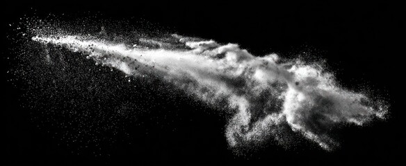 An eruption of bright, white dust trails across a stark black background, creating a dramatic contrast