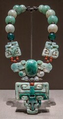 Jade necklace with intricate carvings.