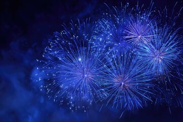 Night sky bursts with vibrant blue fireworks