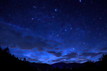 Fototapeta premium Starry night sky over mountains