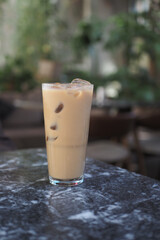 Refreshing iced coffee served in a tall glass with ice