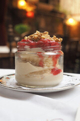 Delicious dessert layered with fruit and granola in a cafe