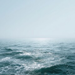 Fototapeta premium Vast, serene ocean, pale sky