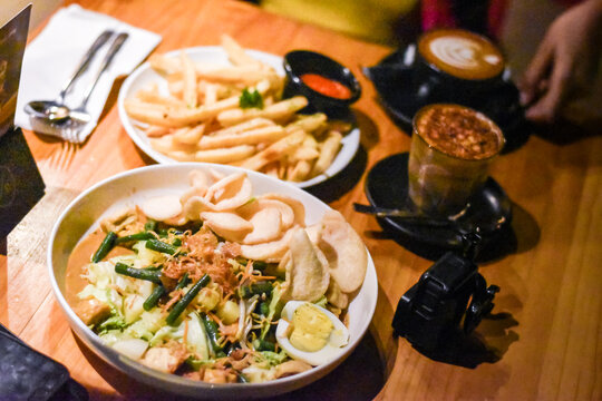 delicious gadogado food with french fries and coffee