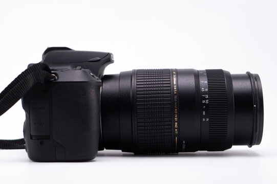 Fototapeta Black DSLR Camera with Zoom Lens on White Background, Studio Shot.