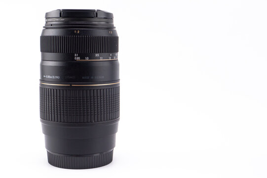 Black Camera Lens Isolated on White Background, Photography Equipment, Professional Optics, Close-up View.