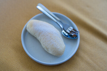 Top view of delicious cream filled buns with powdered sugar