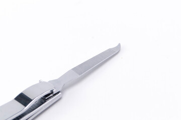 Silver Manicure Set with Nail File on White Background, Close-Up View.