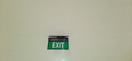 notice board with exit written on it, exit written on it with green background
