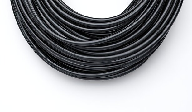 Coiled black cable on white background (1)