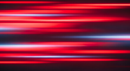 Abstract background of vibrant red and blue horizontal light streaks creating a sense of speed and motion.