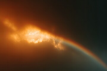 Dramatic sunset through clouds with a rainbow