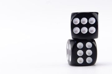 Stacked Black Dice Showing Sixes on White Background, Game of Chance, Gambling Concept.