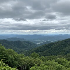Naklejka premium Mountain range landscape with cloudy sky