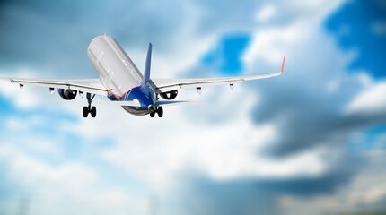 Classic big Airplane flies in blue sunset sky.