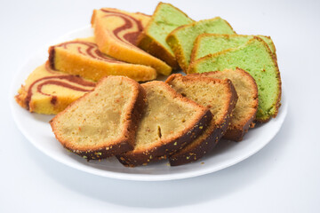 Sponge cake is a cake based on flour (usually wheat flour), sugar, butter and eggs, and is sometimes leavened with baking powder. It has a firm, yet well aerated structure, similar to a sea sponge. 

