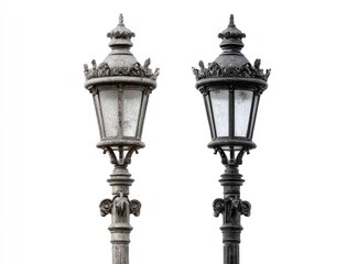 Two vintage street lamps, one light gray, one dark gray