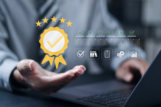 Quality control certification concept, check guarantee of standard of company product. checklist documents, assessment for certificate and document approved. Businessman use laptop with virtual icon.