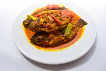 Ikan Nila bumbu kuning, Traditional Menu from West Indonesia, Made from Fried Tilapia and yellow sauce made from turmeric