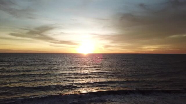 The beauty of the sunset at Kedungu Beach, Bali, seen from a drone
