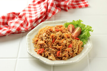Spicy Fried Noodles with Chili Served on a Cream Hexagonal Plate