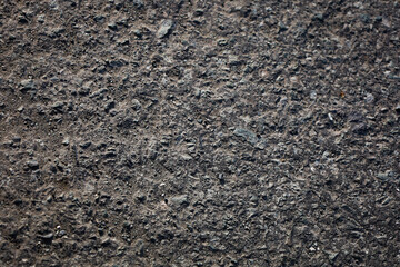 Grungy Detailed Asphalt Surface Texture with Small Stone Elements Close Up